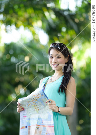 One young Chinese woman having holiday traveling in tropical country One young Chinese woman having holiday traveling in tropical country 13776099