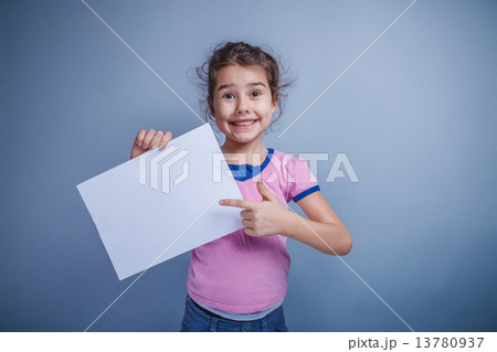 girl child 6 years of European appearance holds a clean sheet, s 13780937