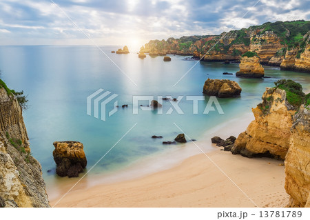 Sea beach at sunset. Cloudy sky. Portugal, Algarve, Lagos. 13781789