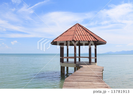 Wooden pier with pavilion in the sea Wooden pier with pavilion in the sea 13781913