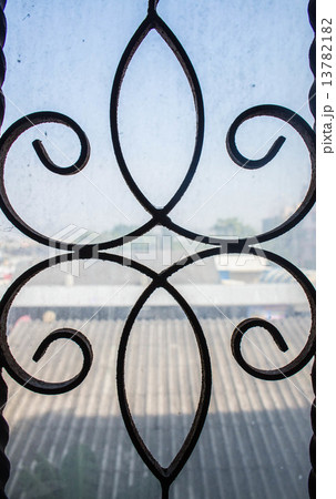 iron window with an old. iron window with an old. 13782182