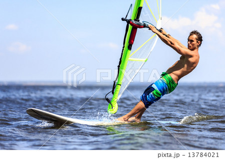 Fast approaching windsurfer 13784021