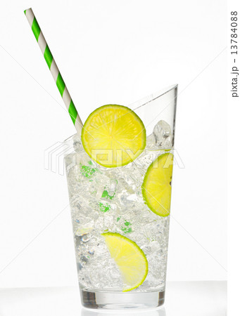 glass with juice and ice cubes glass with juice and ice cubes 13784088