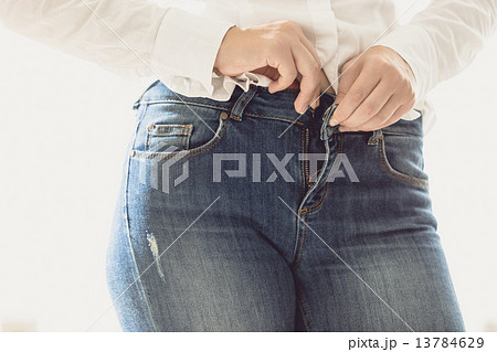 sexy woman unbuttoning her jeans sexy woman unbuttoning her jeans 13784629