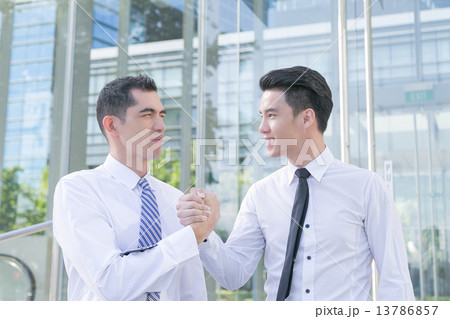 Successful and motivated businessmen are shaking hands 13786857
