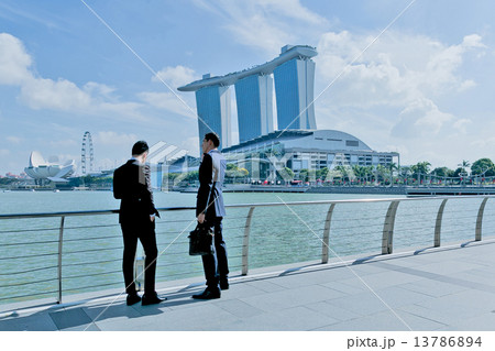 Two businessman are waiting for the client in front of Marina Bay Sands 13786894