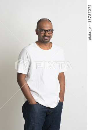 casual indian male smiling full length with jeans 13787072