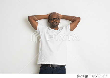 casual indian male on jeans and shirt relaxed pose casual indian male on jeans and shirt relaxed pose 13787073
