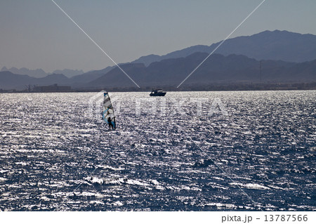 Silhouette of a windsurfer 13787566