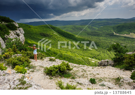 Young woman against the storm 13788645