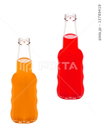 bottle of strawberry and orange juices bottle of strawberry and orange juices 13789419