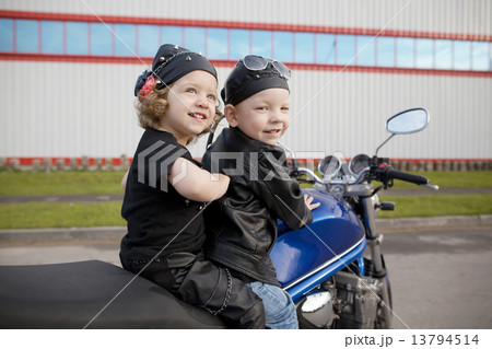 little bikers on road with motorcycle 13794514