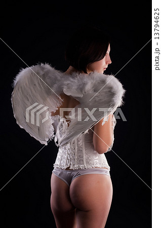Back view of young woman in angel role Back view of young woman in angel role 13794625
