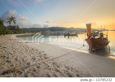 sunset with colorful sky and boat on the beach sunset with colorful sky and boat on the beach 13795232
