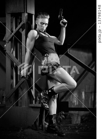 Woman in uniform with gun (monochrome version) 13798148