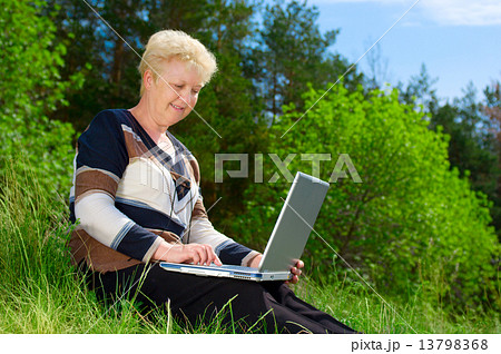 Senior woman in forest Senior woman in forest 13798368