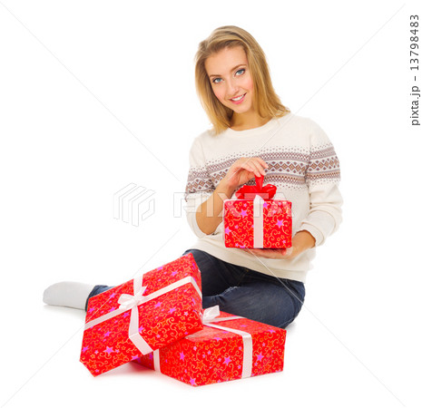 Young girl with gift boxes 13798483