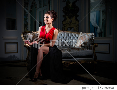 Young woman sit on sofa at ancient room 13798938