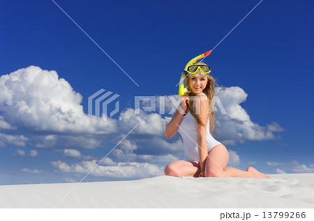 Girl with diving mask on the beach 13799266