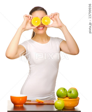 Young girl with orange slices Young girl with orange slices 13799936