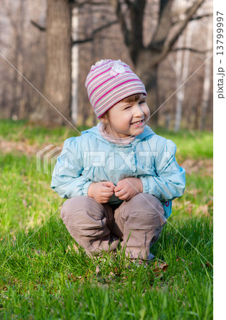 Little smiling girl at forest 13799997