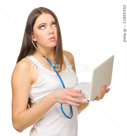 Young girl listen laptop by stethoscope Young girl listen laptop by stethoscope 13800302