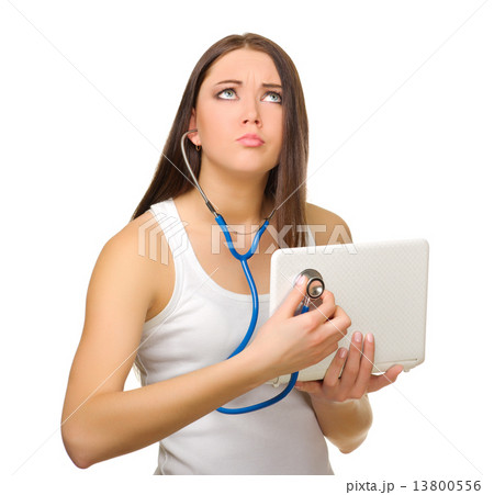 Young girl listen laptop by stethoscope Young girl listen laptop by stethoscope 13800556