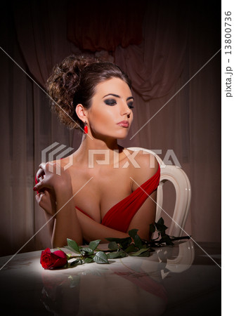 Young woman with rose flower sit on chair 13800736