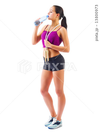 Young sporty girl with water bottle and skipping rope 13800973