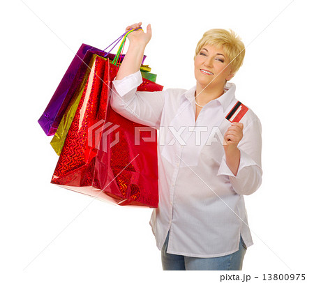 Mature woman with credit card and bags Mature woman with credit card and bags 13800975