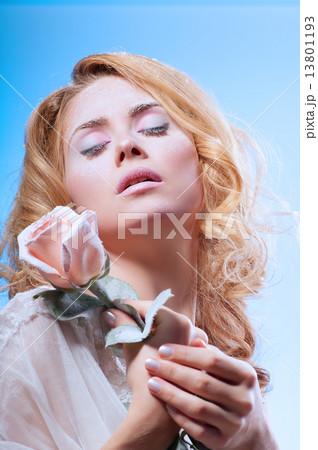 Young beautiful woman with snowy skin 13801193