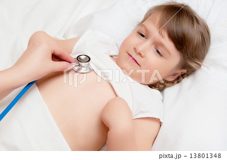 Listening of girl by stethoscope 13801348