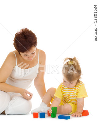 Small girl build pyramid with mother Small girl build pyramid with mother 13801634