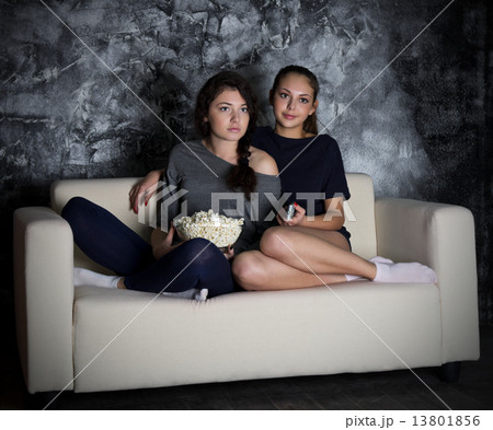 Two girls looks TV 13801856
