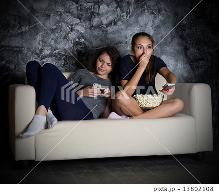 Two girls looks TV Two girls looks TV 13802108