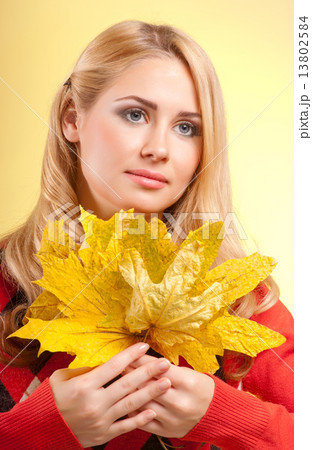 Young woman in red sweater Young woman in red sweater 13802584