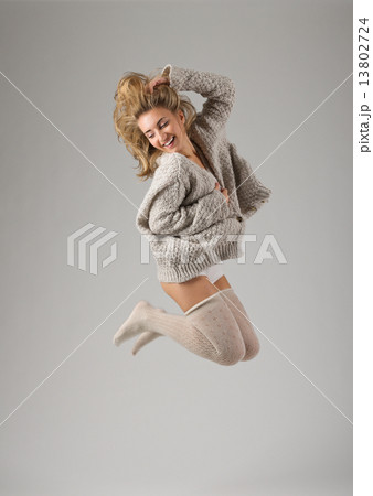Fashion style portrait of young jumping girl 13802724