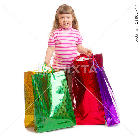 Little smiling girl with bags 13802747