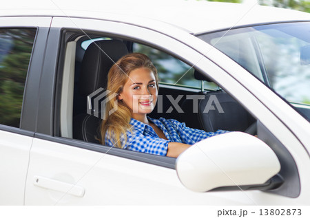 Woman is driving car 13802873