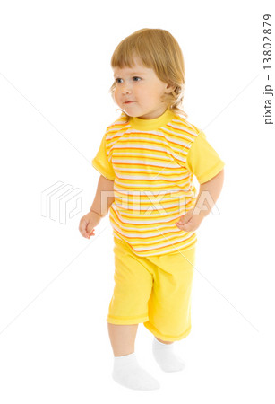 Small girl in yellow shirt and pants Small girl in yellow shirt and pants 13802879