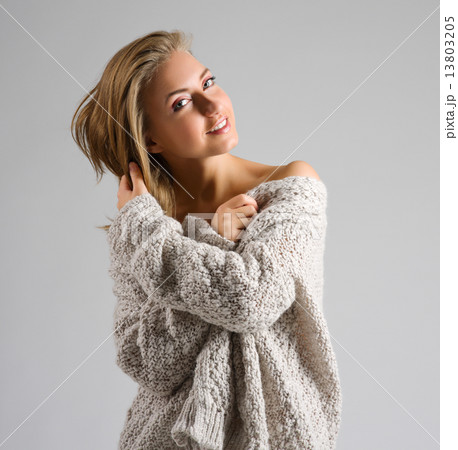 Fashion style portrait of young girl on grey 13803205