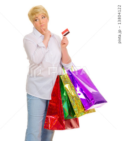 Happy senior woman with bags and credit card 13804122
