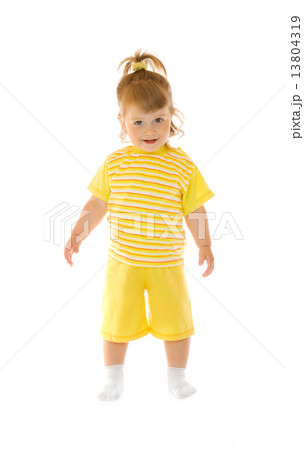 Small smiling girl in yellow pants and shirt 13804319