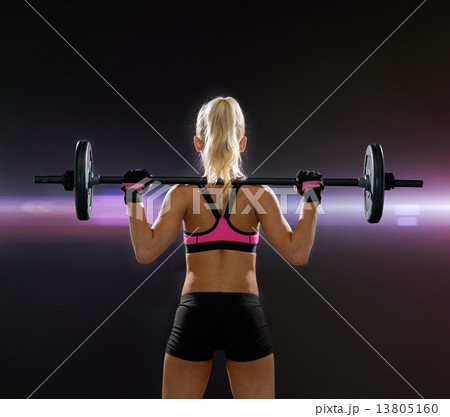 sporty woman exercising with barbell from back sporty woman exercising with barbell from back 13805160