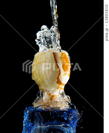 Falling water to stone bowl isolated Falling water to stone bowl isolated 13805810