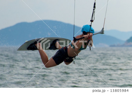 Close-up of female kite surfer going horizontal 13805984