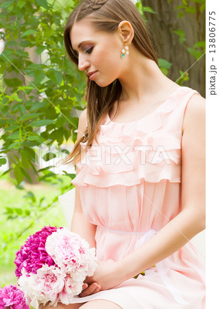 Attractive woman with flowers Attractive woman with flowers 13806775