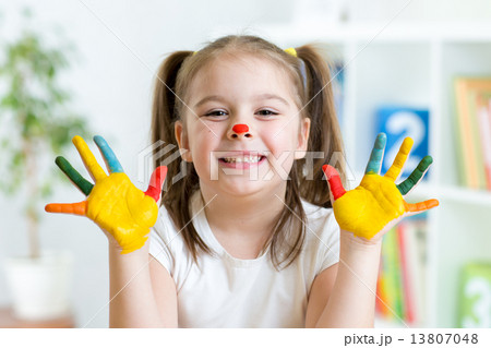 Cute little girl with painted hands 13807048