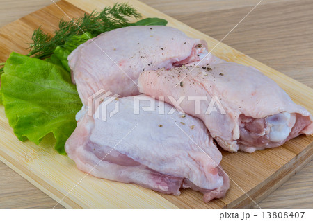 Raw chicken thighs Raw chicken thighs 13808407