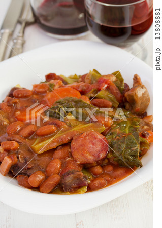 stew in the plate with glass of red wine 13808881